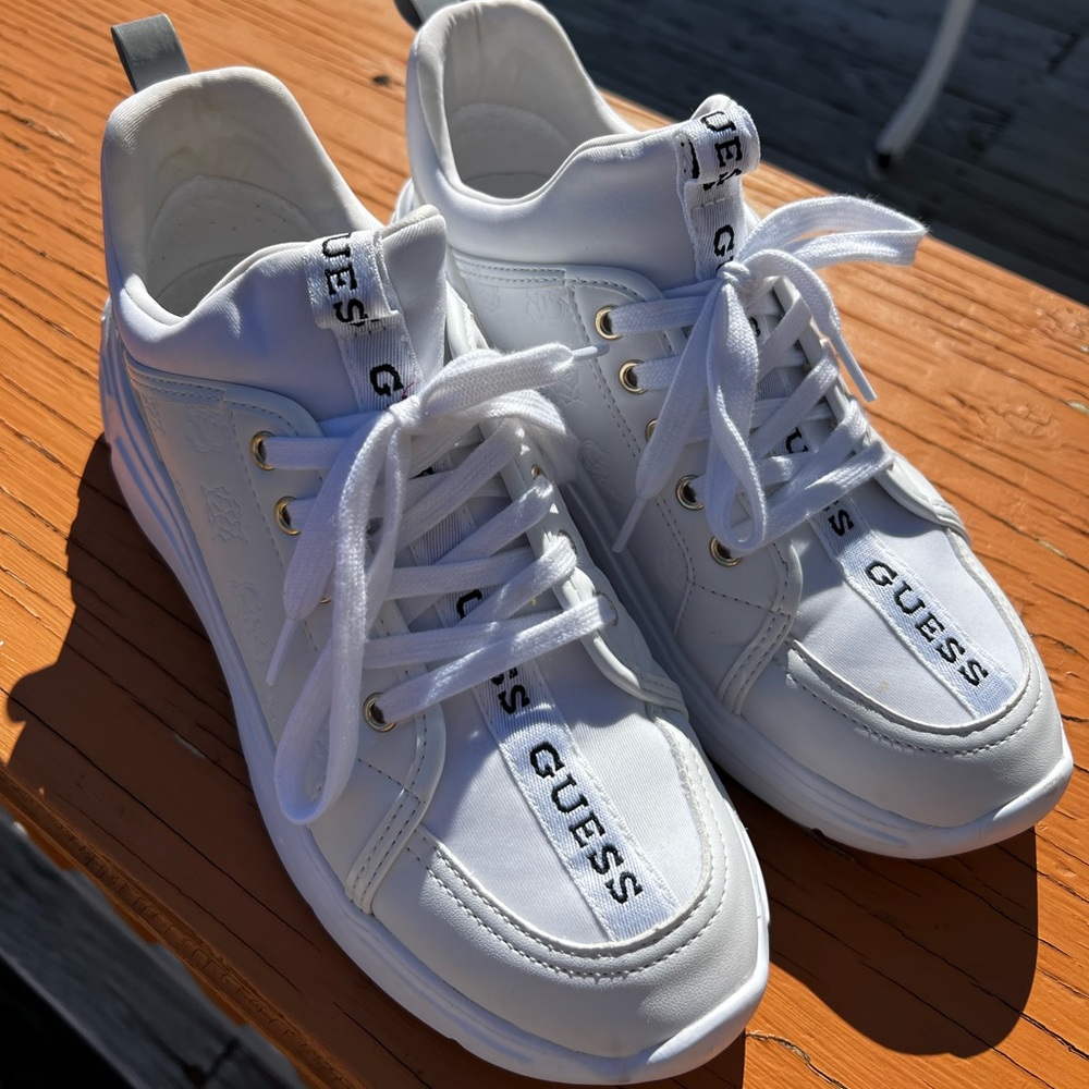 8.5 women’s slip on GUESS sneakers.